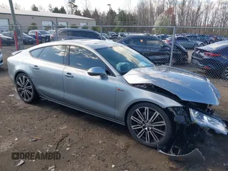 2012 Audi A7 Premium Plus with VIN WAUYGAFC4CN137727, listed as a IAAI auction lot 41881239 with 109,901 mi miles and . Bid and sale history available at DreamBid. Image 1.