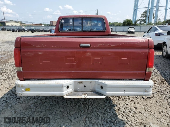 1987 Ford F-150 with VIN 1FTDF15Y9HNA25725, listed as a Copart auction lot 67257004 with 71,808 mi miles and Salvage Title. Bid and sale history available at carsss.com. Image 6.