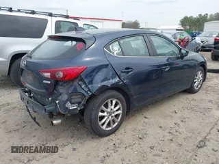 2014 Mazda 3 i Grand Touring with VIN JM1BM1M77E1133477, listed as a IAAI auction lot 41861051 with 124,377 mi miles and . Bid and sale history available at DreamBid. Image 4.