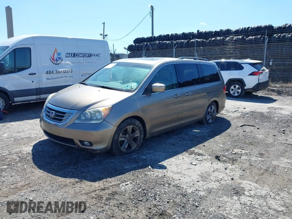2010 Honda Odyssey Touring with VIN 5FNRL3H9XAB094765, listed as a IAAI auction lot 41892743 with 127,143 mi miles. Bid and sale history available at carsss.com. Image 17.
