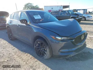 2021 Mazda CX-5 Touring with VIN JM3KFACM1M0371354, listed as a IAAI auction lot 40938490 with 56,172 mi miles. Bid and sale history available at carsss.com. Image 1.