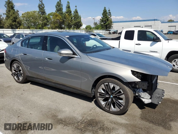 2024 BMW 5 Series 530i with VIN WBA43FJ06RCR20072, listed as a Copart auction lot 69864814 with 4,871 mi miles and Salvage Title. Bid and sale history available at carsss.com. Image 4.
