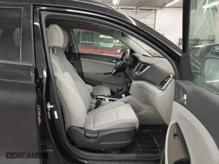 2018 Hyundai Tucson Value with VIN KM8J3CA28JU648236, listed as a IAAI auction lot 41161221 with 104,057 mi miles. Bid and sale history available at carsss.com. Image 5.