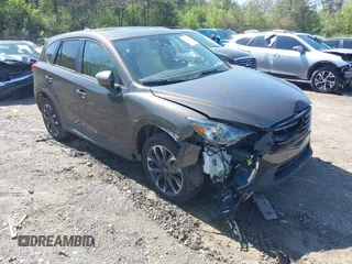 2016 Mazda CX-5 Grand Touring z VIN JM3KE4DY1G0907472, wystawiony jako IAAI lot #41830392 z przebiegiem 125 580 mil mil oraz . Historia ofert i sprzedaży dostępna na DreamBid. Obrazek 1.