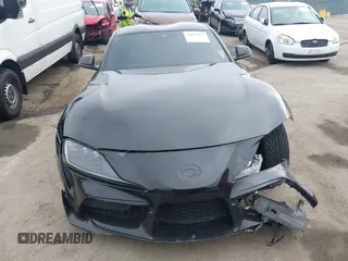 2021 Toyota Supra 2.0 with VIN WZ1DB2C07MW042723, listed as a IAAI auction lot 42635977 with 54,011 mi miles and . Bid and sale history available at DreamBid. Image 12.
