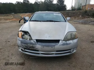 2003 Hyundai Tiburon GT z VIN KMHHN65F13U013420, wystawiony jako Copart lot #51234495 z przebiegiem 230 612 mil mil oraz Szkoda całkowita • Salvage title. Historia ofert i sprzedaży dostępna na DreamBid. Obrazek 5.