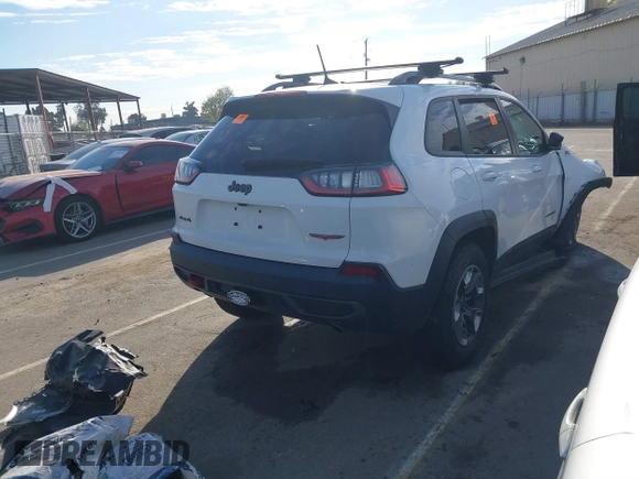 2019 Jeep Cherokee Trailhawk Elite with VIN 1C4PJMBX7KD410612, listed as a IAAI auction lot 41878935 with 55,163 mi miles. Bid and sale history available at carsss.com. Image 4.
