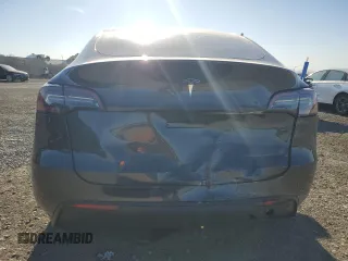 2024 Tesla Model Y with VIN 7SAYGDED4RF017614, listed as a Copart auction lot 88494625 with 11,209 mi miles and Salvage title. Bid and sale history available at DreamBid. Image 6.