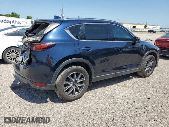 2018 Mazda CX-5 Grand Touring с VIN JM3KFBDM8J0344328, выставлен на аукционе Copart как лот 57665175 с пробегом 131 175 миль миль и Списание • Salvage title. История ставок и продаж доступна на DreamBid. Изображение 3.