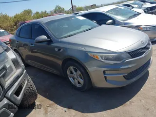 2016 Kia Optima LX z VIN 5XXGT4L31GG025565, wystawiony jako IAAI lot #42349997 z przebiegiem 170 409 mil mil oraz . Historia ofert i sprzedaży dostępna na DreamBid. Obrazek 1.