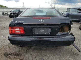 1999 Mercedes-Benz SL 500 z VIN WDBFA68F4XF185727, wystawiony jako Copart lot #58572645 z przebiegiem 107 881 mil mil oraz Szkody całkowita. Historia ofert i sprzedaży dostępna na DreamBid. Obrazek 6.