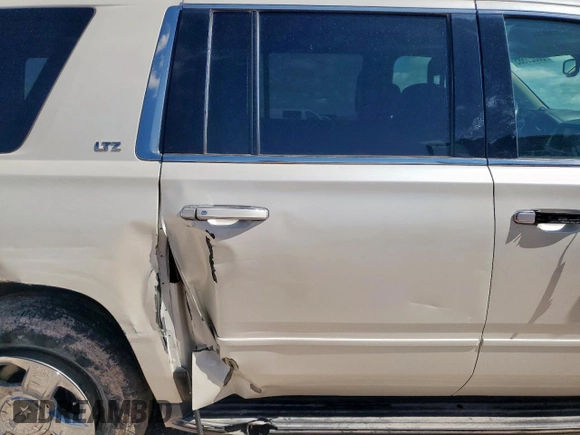 2015 Chevrolet Suburban LTZ with VIN 1GNSCKKC6FR705660, listed as a Copart auction lot 60328685 with 174,247 mi miles and Salvage title. Bid and sale history available at DreamBid. Image 11.