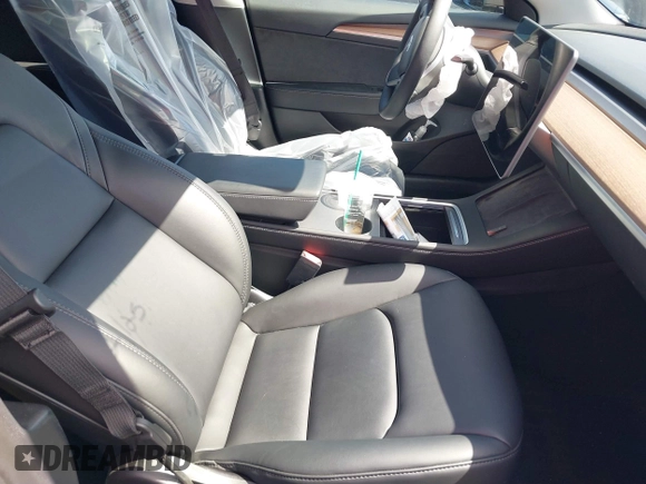 2022 Tesla Model 3 with VIN 5YJ3E1EA0NF344782, listed as a IAAI auction lot 41803469 with 16,973 mi miles and . Bid and sale history available at DreamBid. Image 5.