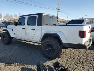 2022 Jeep Gladiator Willys with VIN 1C6HJTAG9NL143314, listed as a Copart auction lot 87974155 with 25,106 mi miles and Salvage title. Bid and sale history available at DreamBid. Image 2.