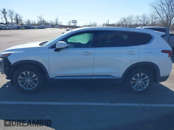 2019 Hyundai Santa Fe SEL z VIN 5NMS3CADXKH071437, wystawiony jako IAAI lot #41752902 z przebiegiem 66 980 mil mil oraz . Historia ofert i sprzedaży dostępna na DreamBid. Obrazek 14.