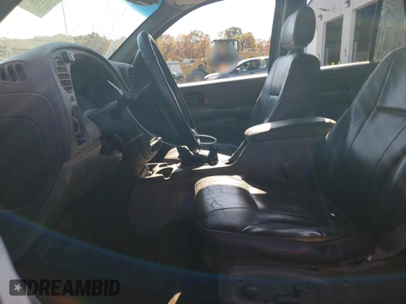 2003 Chevrolet TrailBlazer LTZ with VIN 1GNDT13S432406018, listed as a Copart auction lot 77605264 with 236,196 mi miles and Clean Title. Bid and sale history available at DreamBid. Image 7.
