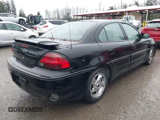 2004 Pontiac Grand Am GT with VIN 1G2NW52E64M677552, listed as a IAAI auction lot 41101595 with 100,644 mi miles. Bid and sale history available at carsss.com. Image 4.