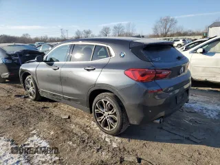 2020 BMW X2 xDrive28i with VIN WBXYJ1C00L5P51384, listed as a Copart auction lot 87406814 with 52,807 mi miles and Salvage Title. Bid and sale history available at carsss.com. Image 2.
