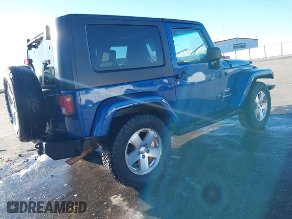 2009 Jeep Wrangler Sahara z VIN 1J4FA54199L722192, wystawiony jako IAAI lot #41619305 z przebiegiem 105 545 mil mil oraz . Historia ofert i sprzedaży dostępna na DreamBid. Obrazek 4.