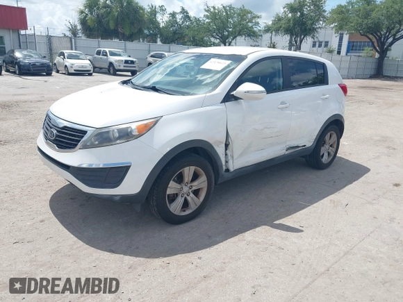 2012 Kia Sportage LX with VIN KNDPB3A2XC7237360, listed as a IAAI auction lot 42478625 with 122,824 mi miles and . Bid and sale history available at DreamBid. Image 2.