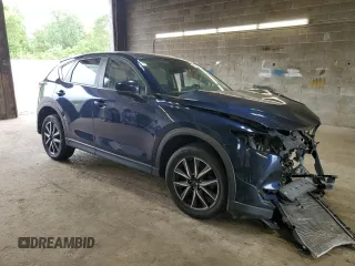 2018 Mazda CX-5 Touring z VIN JM3KFBCM3J0464815, wystawiony jako Copart lot #58794685 z przebiegiem Nie podano mil oraz Szkoda całkowita • Salvage title. Historia ofert i sprzedaży dostępna na DreamBid. Obrazek 4.