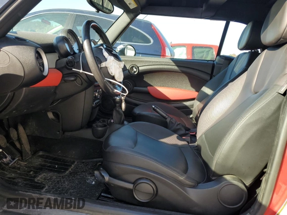 2013 MINI Convertible with VIN WMWZN3C58DT265980, listed as a Copart auction lot 77157154 with 88,975 mi miles and Salvage title. Bid and sale history available at DreamBid. Image 7.