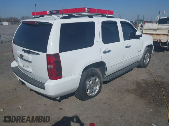 2014 Chevrolet Tahoe LT with VIN 1GNSCBE06ER233105, listed as a IAAI auction lot 41753190 with 161,056 mi miles and . Bid and sale history available at DreamBid. Image 4.