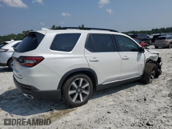 2023 Honda Pilot Touring with VIN 5FNYG2H77PB014212, listed as a Copart auction lot 59222715 with 4,507 mi miles and Salvage title. Bid and sale history available at DreamBid. Image 3.