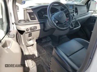 2023 Ford Transit Cargo with VIN 1FTBR1Y88PKA97221, listed as a Copart auction lot 43410475 with 34,927 mi miles and Salvage Title. Bid and sale history available at DreamBid. Image 8.