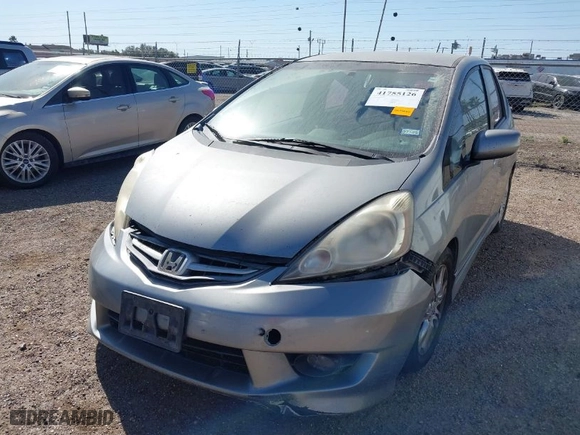 2009 Honda Fit Sport w/Navi with VIN JHMGE88619S020572, listed as a IAAI auction lot 41755126 with 202,358 mi miles. Bid and sale history available at carsss.com. Image 2.