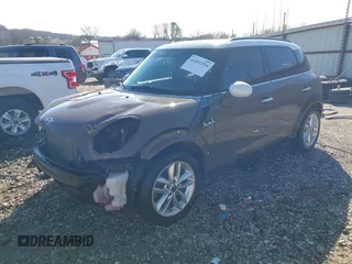 2014 MINI Countryman S with VIN WMWZC3C5XEWP52054, listed as a IAAI auction lot 41452354 with 104,873 mi miles and . Bid and sale history available at DreamBid. Image 2.