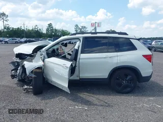 2019 Honda Passport Touring z VIN 5FNYF7H91KB001286, wystawiony jako IAAI lot #41733668 z przebiegiem Nie podano mil oraz . Historia ofert i sprzedaży dostępna na DreamBid. Obrazek 13.