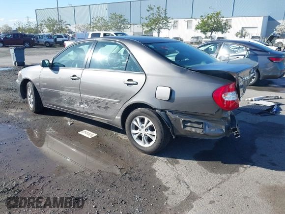 2004 Toyota Camry LE with VIN 4T1BF30K94U577260, listed as a IAAI auction lot 41906287 with 68,499 mi miles. Bid and sale history available at carsss.com. Image 3.