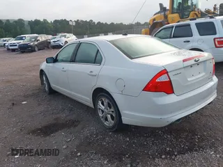 2012 Ford Fusion SE z VIN 3FAHP0HG3CR445925, wystawiony jako IAAI lot #42664342 z przebiegiem 194 798 mil mil oraz . Historia ofert i sprzedaży dostępna na DreamBid. Obrazek 3.