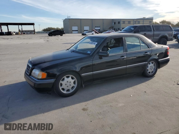 1994 Mercedes-Benz C with VIN WDBHA28E5RF090458, listed as a Copart auction lot 82380184 with Not Provided miles and Salvage Title. Bid and sale history available at carsss.com. Image 1.