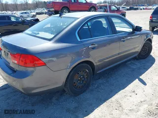 2009 Kia Optima LX with VIN KNAGE228195301338, listed as a IAAI auction lot 41904987 with 153,197 mi miles. Bid and sale history available at carsss.com. Image 4.