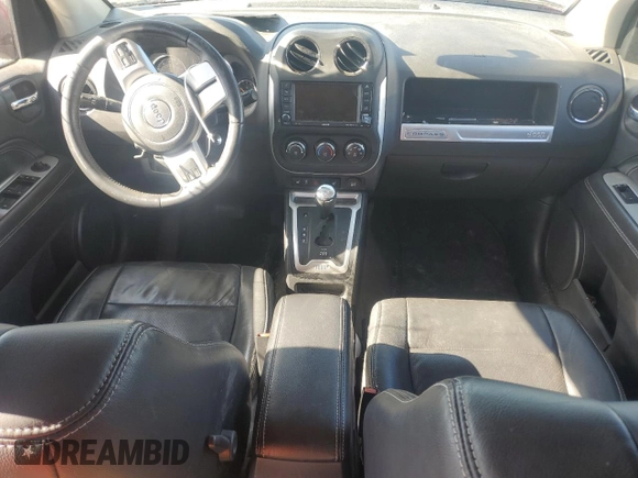 2017 Jeep Compass High Altitude with VIN 1C4NJDEBXHD128299, listed as a Copart auction lot 52846095 with 64,395 mi miles and Salvage Title. Bid and sale history available at DreamBid. Image 8.