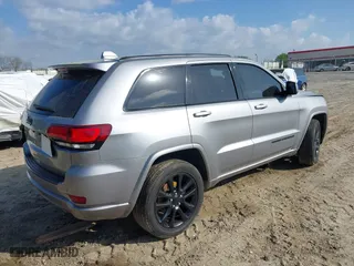 2018 Jeep Grand Cherokee Laredo E with VIN 1C4RJFAG0JC284927, listed as a IAAI auction lot 41964013 with 130,145 mi miles. Bid and sale history available at carsss.com. Image 4.