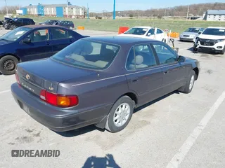 1996 Toyota Camry DX with VIN 4T1BG12K8TU915891, listed as a IAAI auction lot 41874731 with 57,564 mi miles. Bid and sale history available at carsss.com. Image 4.