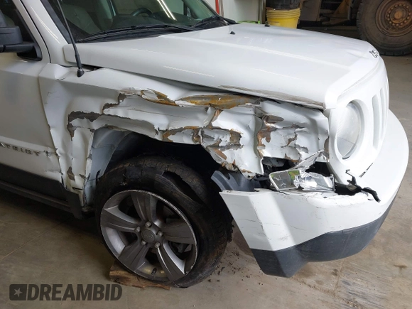 2014 Jeep Patriot Latitude with VIN 1C4NJPFA0ED680509, listed as a IAAI auction lot 41801775 with 147,418 mi miles and . Bid and sale history available at carsss.com. Image 6.