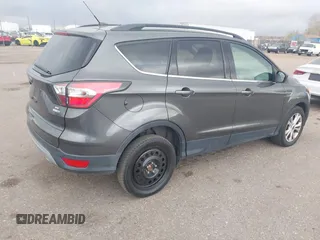 2017 Ford Escape SE with VIN 1FMCU9GD1HUB46034, listed as a IAAI auction lot 41840906 with 143,806 mi miles. Bid and sale history available at carsss.com. Image 4.