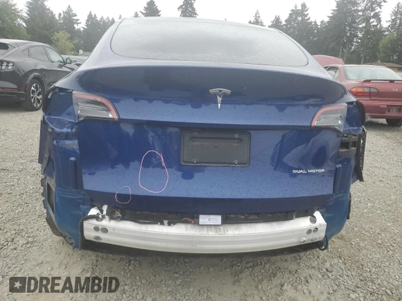 2022 Tesla Model Y Long Range z VIN 7SAYGDEE6NF429651, wystawiony jako Copart lot #57172355 z przebiegiem 19 499 mil mil oraz Szkoda całkowita • Salvage title. Historia ofert i sprzedaży dostępna na DreamBid. Obrazek 6.