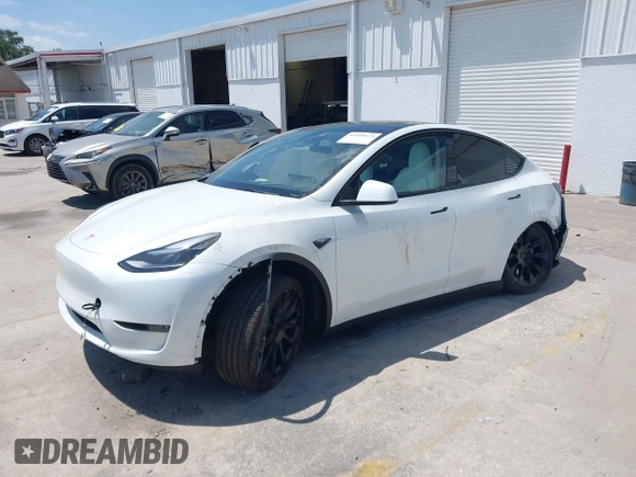 2023 Tesla Model Y Long Range with VIN 7SAYGDEE7PF865539, listed as a IAAI auction lot 42109673 with 34,923 mi miles and . Bid and sale history available at DreamBid. Image 17.