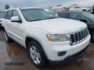 2011 Jeep Grand Cherokee Laredo z VIN 1J4RR4GG1BC572827, wystawiony jako IAAI lot #42313674 z przebiegiem 273 215 mil mil oraz . Historia ofert i sprzedaży dostępna na DreamBid. Obrazek 1.