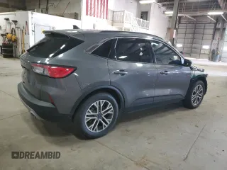 2021 Ford Escape SEL z VIN 1FMCU0H66MUB04206, wystawiony jako Copart lot #56638585 z przebiegiem Nie podano mil oraz Szkoda całkowita • Salvage title. Historia ofert i sprzedaży dostępna na DreamBid. Obrazek 3.