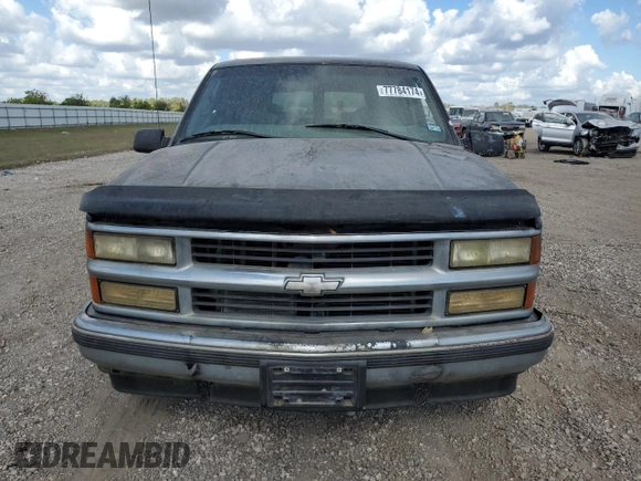 1999 Chevrolet Suburban with VIN 3GNEC16R7XG141671, listed as a Copart auction lot 77784174 with 207,234 mi miles and Salvage Title. Bid and sale history available at carsss.com. Image 5.