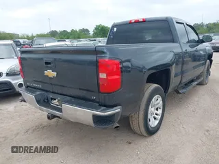 2018 Chevrolet Silverado 1500 LT with VIN 1GCRCREC9JZ105218, listed as a IAAI auction lot 40778682 with 124,621 mi miles and . Bid and sale history available at DreamBid. Image 4.