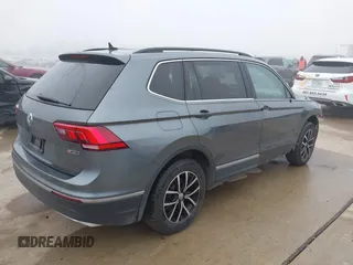 2021 Volkswagen Tiguan SE with VIN 3VV2B7AX8MM143189, listed as a IAAI auction lot 41646843 with 56,672 mi miles and . Bid and sale history available at DreamBid. Image 4.