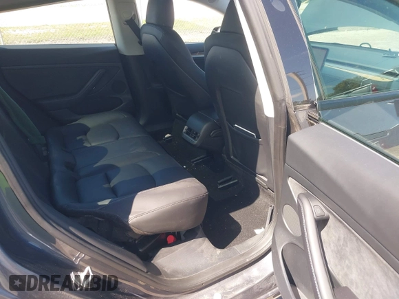 2023 Tesla Model 3 with VIN 5YJ3E1EA8PF626235, listed as a IAAI auction lot 42022893 with 30,333 mi miles and . Bid and sale history available at DreamBid. Image 8.