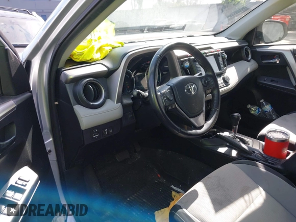 2016 Toyota RAV4 Hybrid XLE with VIN JTMRJREVXGD029019, listed as a IAAI auction lot 42021530 with 74,400 mi miles. Bid and sale history available at carsss.com. Image 6.